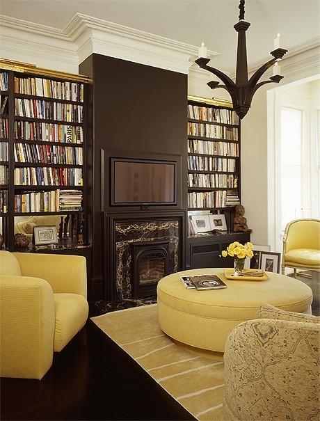 Black and Yellow library with recessed flat screen eclectic family room
